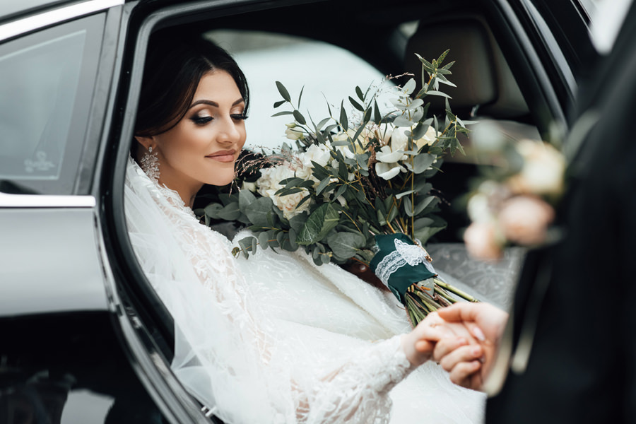 A Bride Coming Out Of A Limousine